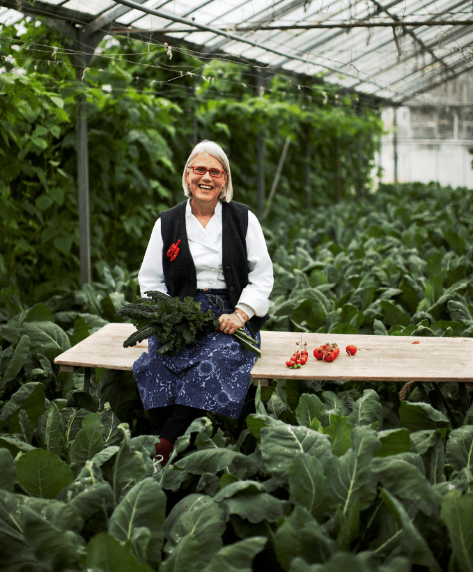 Darina Allen with some Kale in a greenhouse